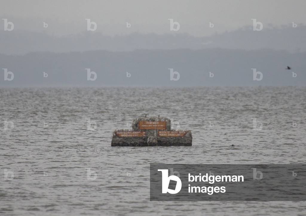 Road sign emerge from the surface of a flooded area, Nakuru district of the rift valley province, Nakuru, Kenya, Africa (photo)