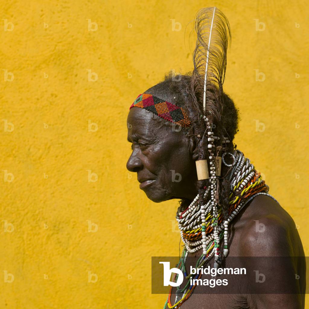 Old Mwila Woman Wearing a Feather, Huila Town Market, Angola, Africa (photo)