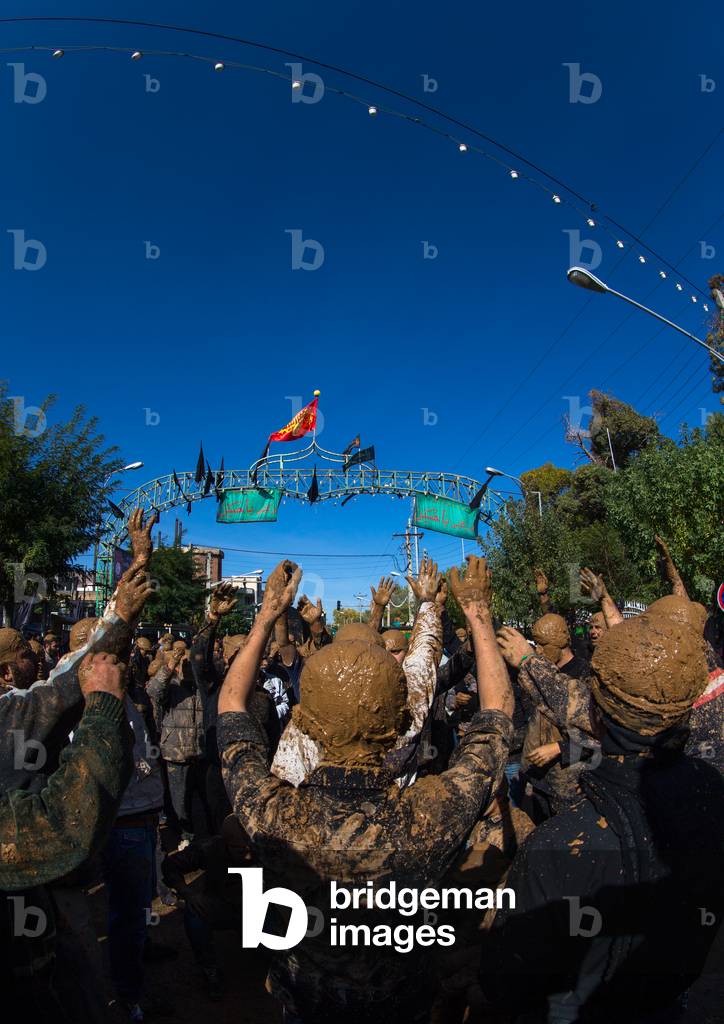 Iranian Shiite Muslim Men Covered in Mud, Chanting and Self-flagellating during Ashura, Kurdistan Province, Bijar, Iran (photo)