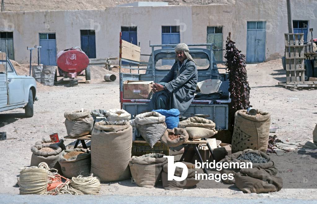 Arab Berger nuts, dates and fruit stall in market place, South Tunisia, North Africa (photo)