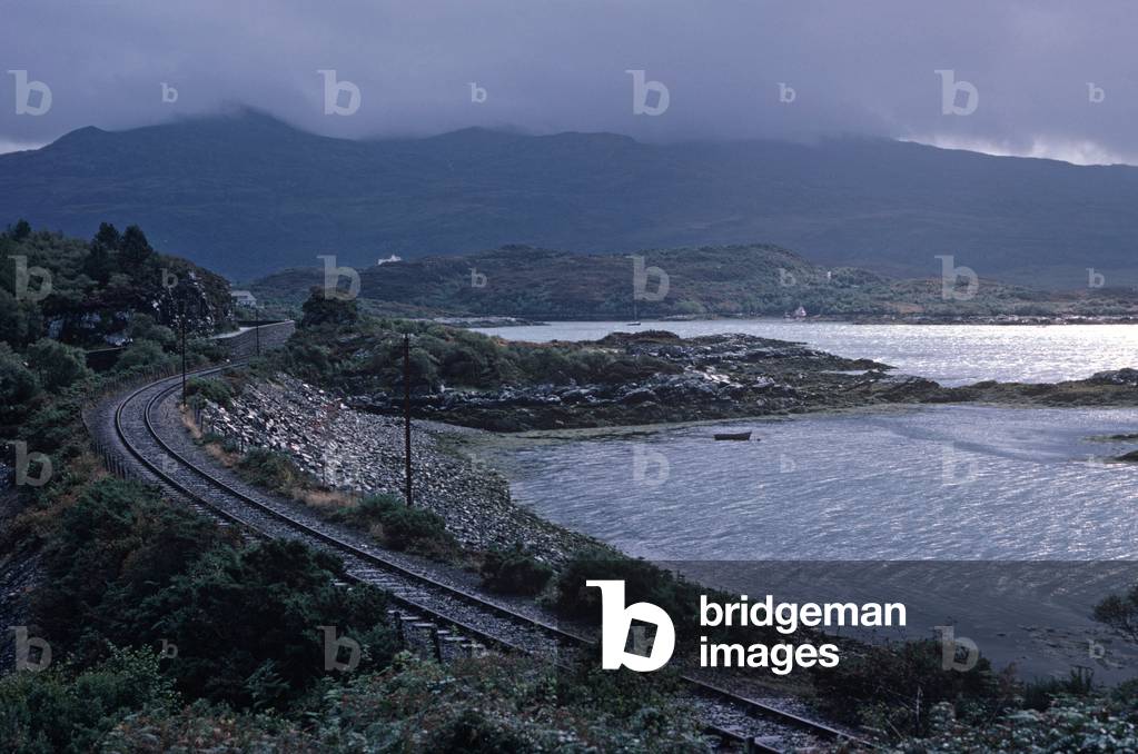 Kyle of Lochalsh Line running alongside Loch Carron, North West Coast of Scotland, 1982 (photograph)
