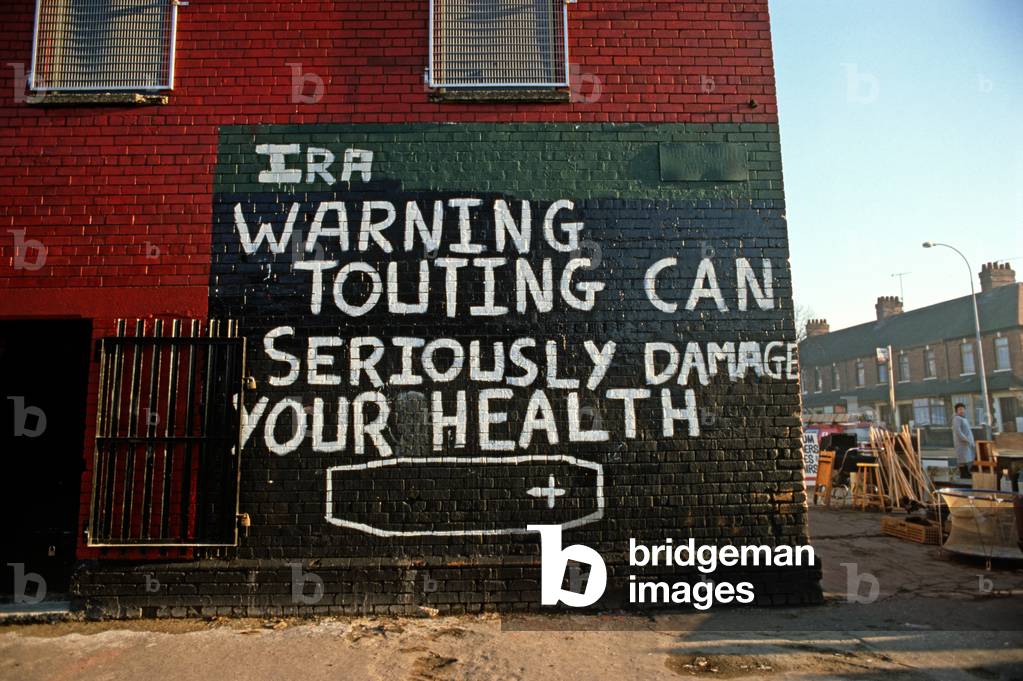 IRA Mural in Republican West Belfast warning that Informers will be seriously dealt with. Northern Ireland during The Troubles, 1983 (photo)