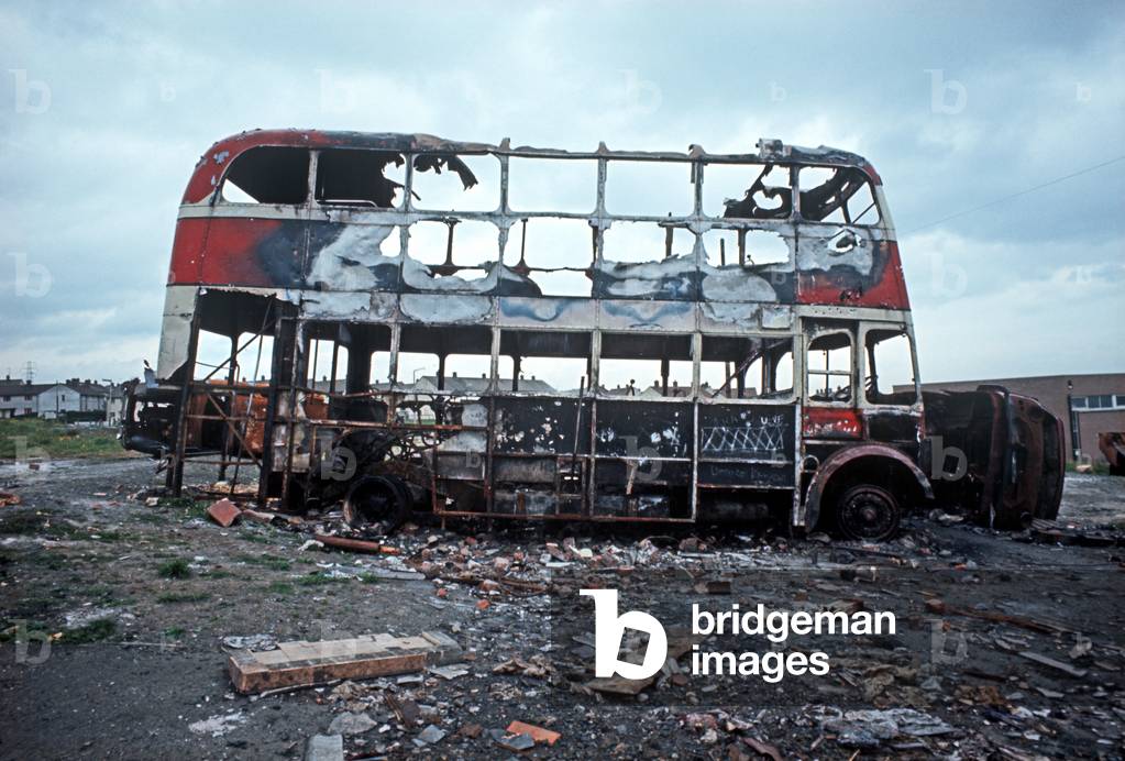 Hijacked Burnt out Vehicles and Bus on Waste Ground in Nationalist West Belfast Ballymurphy Estate during The Troubles, Northern Ireland, 1973