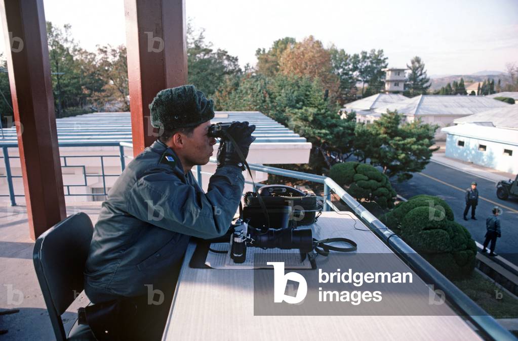 South Korean military observing North Koreans during talks at Panmunjom , Korean Demilitarized Zone, DMZ Line (photo)