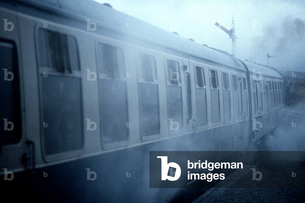 Diesel train at Rannoch Moor railway station on the British Rail Glasgow to Mallaig Line, Inverness-Shire, Scotland, 1982 (photograph)