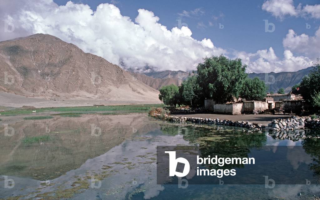 Tibetan village on side of flood plains, Tibetan countryside, Autonomous Region, China (photo)