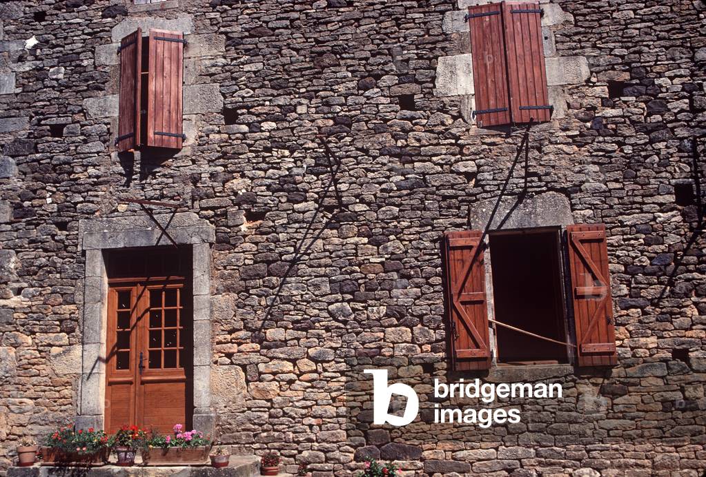 Stone farmhouse with wooden shutters, Lot countryside, France (photo)