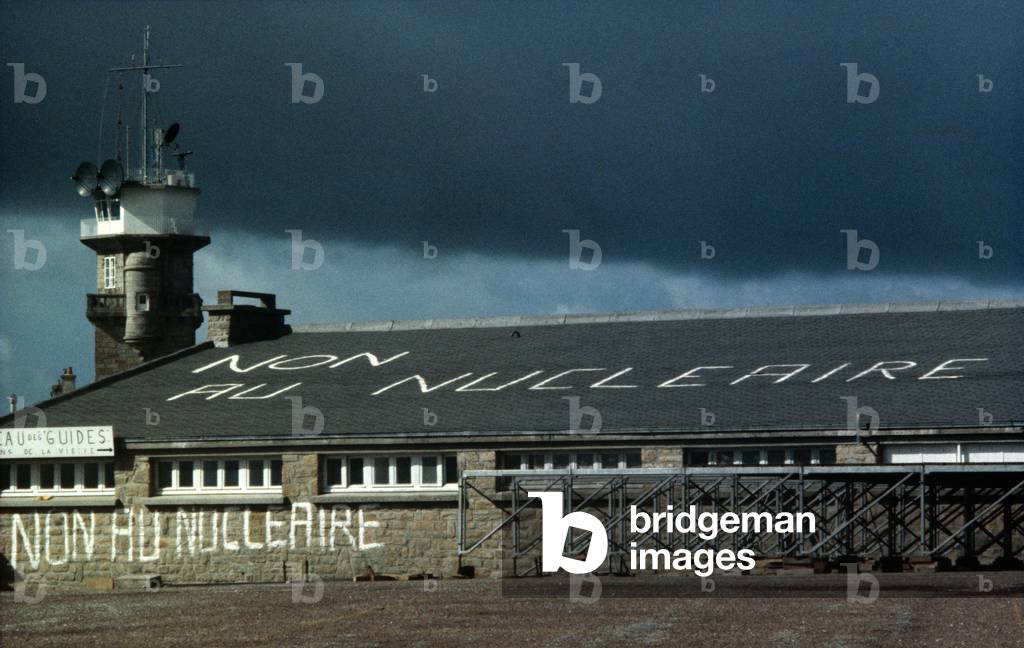 NO to Nuclear power painted on roof in Plogoff, a Brittany, during antinuclear demonstrations, France, 1980 (photo)