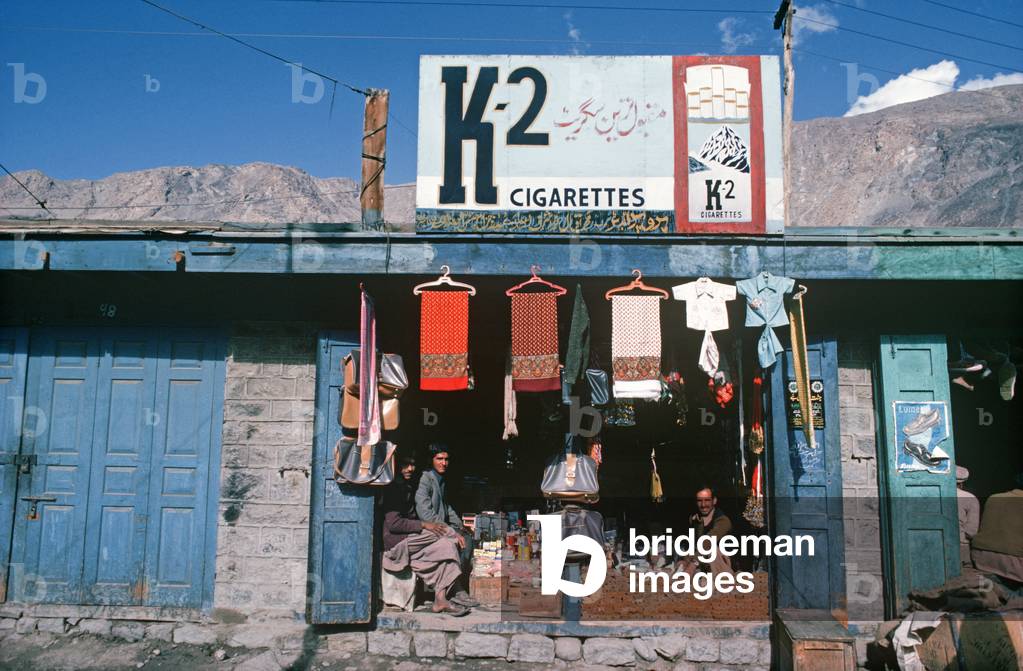 Gilgit shops and advertising K2 cigarette hoarding, Gilgit-Baltistan Administrative Area, Pakistan (photo)