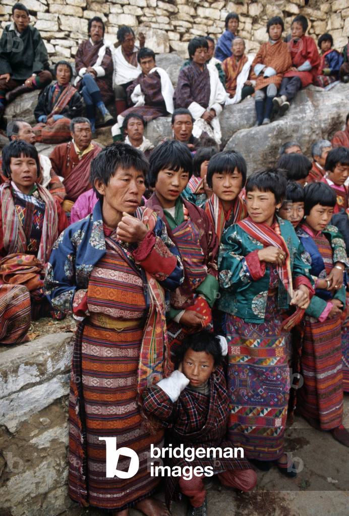 Bhutanese families at the Paro Tshechu, mask dance festival, in the Paro Dzong, Bhutan (photo)