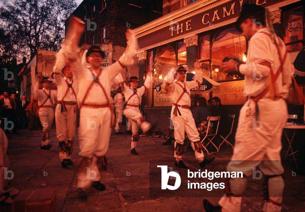 Morris dancers, English folk dance, outside pub Camden Head in the 1970s, Islington, London, UK, 1972  (photo)
