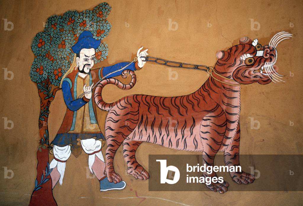 Mongol with chained Tiger mural, Paro monastery, Dzong,  Bhutan (photo)