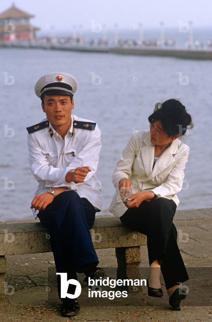 Military officer on Huilan Pavilion and promenade, Qingdao beach resort, Shandong province, China, 1985 (photo)