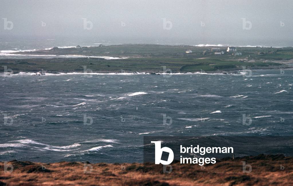 Inishturbot Island in the distance from the coast of Connemara, County Galway, Ireland (photo)