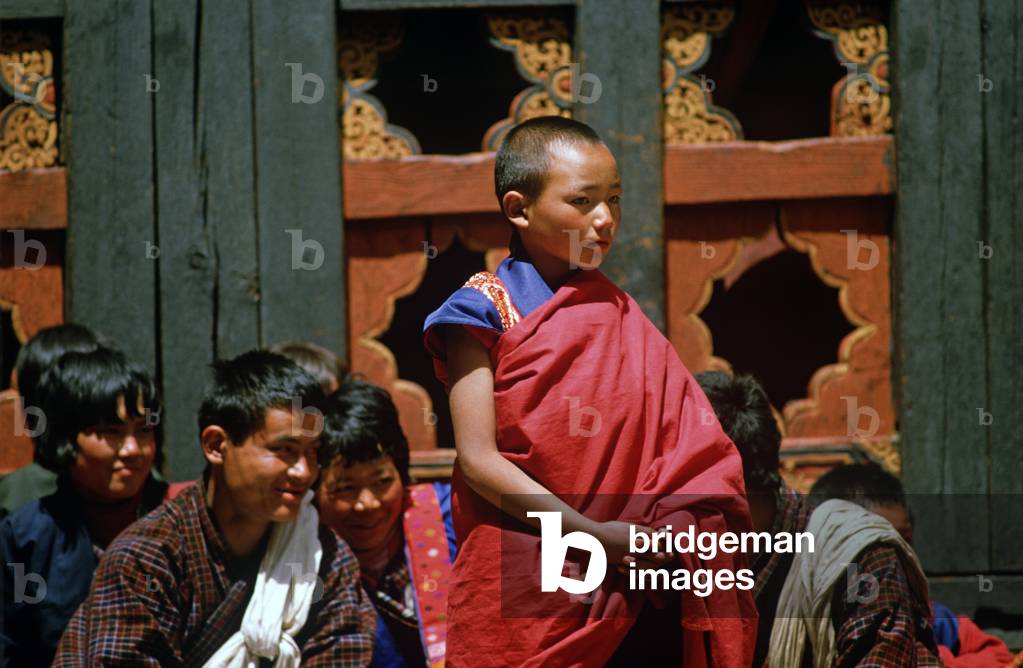 Buddhist child monks at the Paro Tshechu, mask dance festival, in the Paro Dzong, Bhutan (photo)