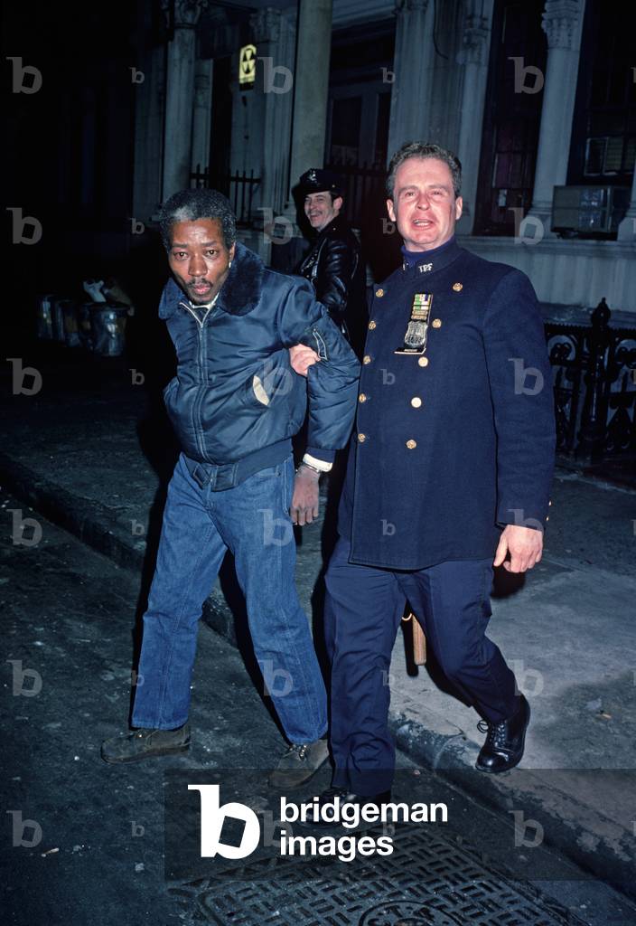 African American being arrested in Harlem by 28th Precinct policeman, New York City, 1978 (photo)