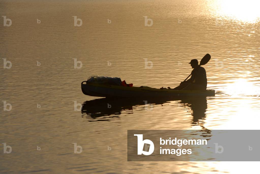 Silhouetted canoeist on Upper Lough Erne, County Fermanagh, Northern Ireland, UK (photo)