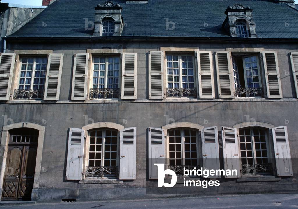 Typical Normandy house with window iron railings and shutters in town of St-Sauveur-Le-Vicomte, Normandy, France (photo)