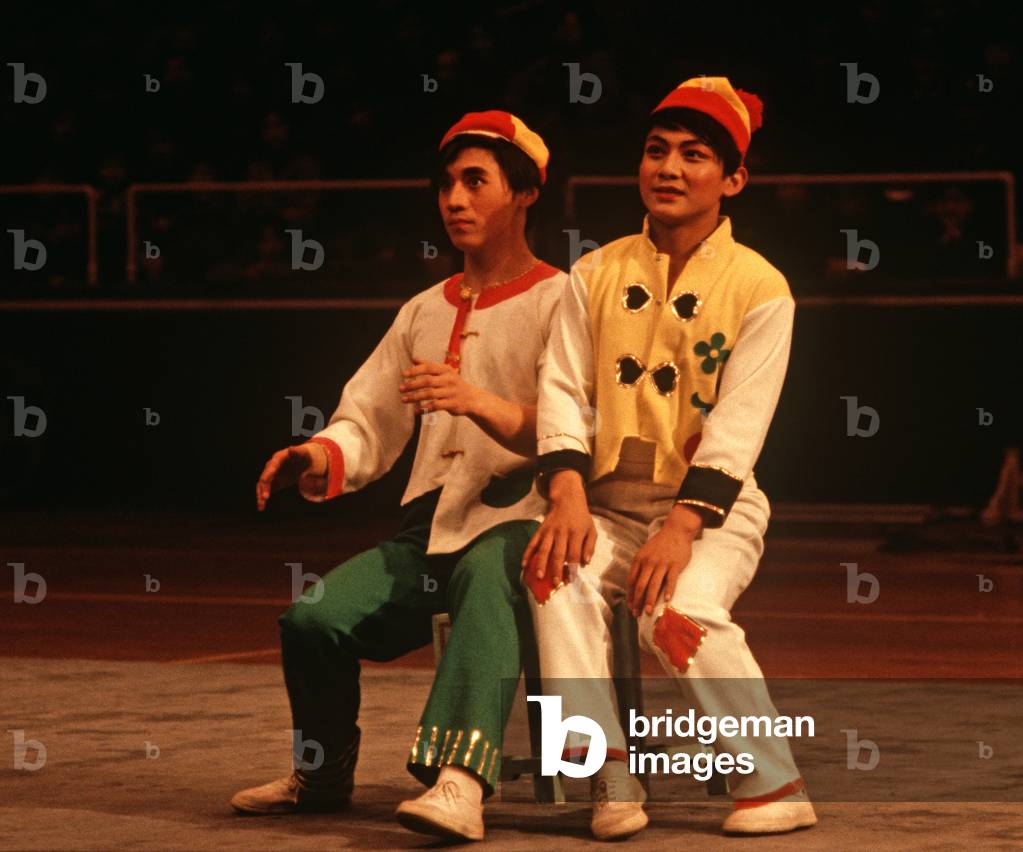 Circus clowns in acrobatic display, Nanjing, China, 1979 (photo)