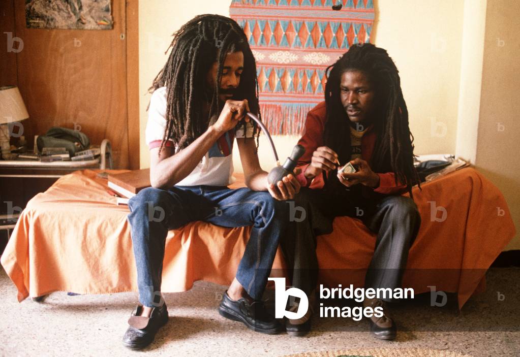 Friends of Augustus Pablo smoking the marijuana pipe, Kingston, Jamaica (photo)