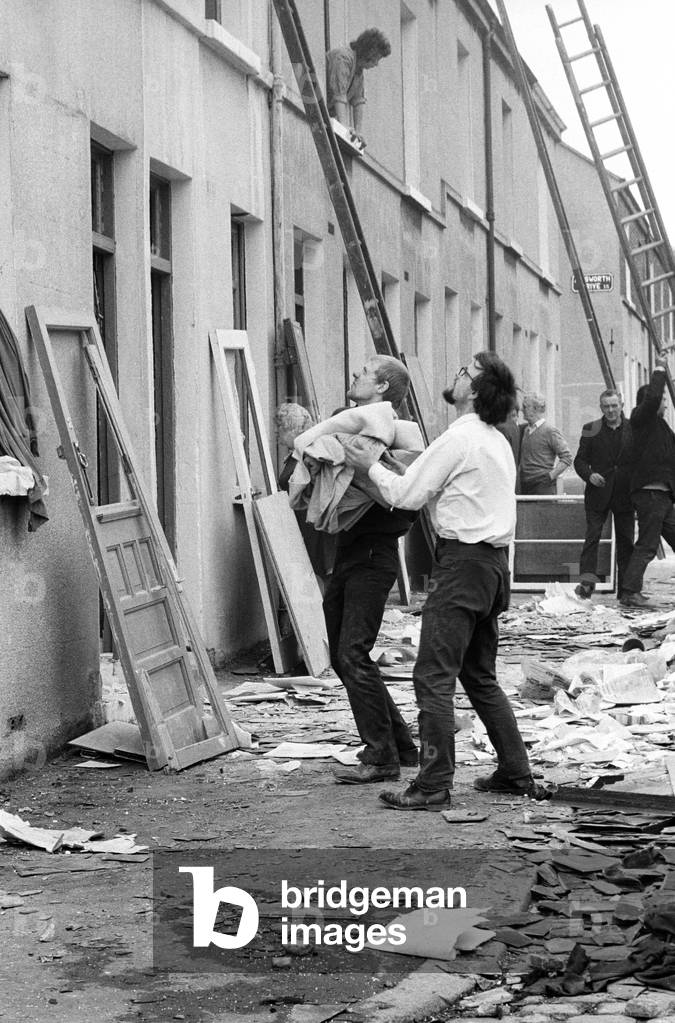 Clearing up after IRA bomb damage in the Shankill Loyalist area of Belfast in the early 70s, Northern Ireland during The Troubles, 1974 (b/w photo)