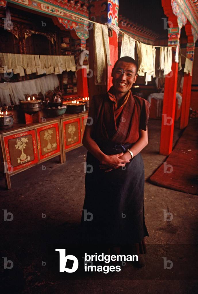 Buddhist monks inside Jokhang Temple, Lhasa, Tibet (photo)