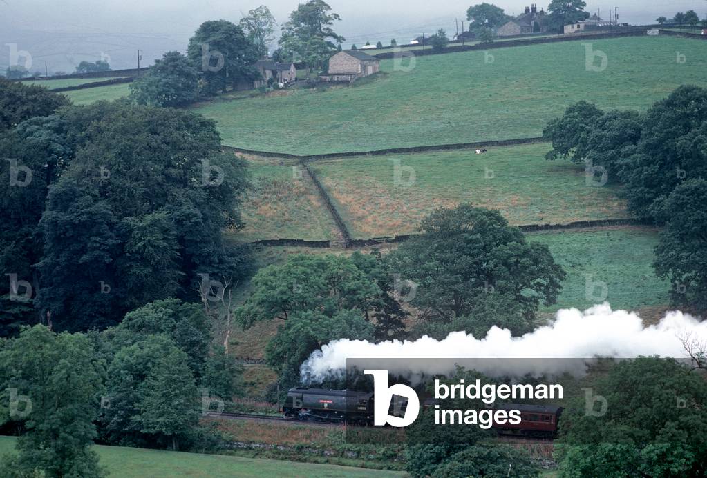 Steam train in the Worth Valley on the heritage Keighley and Worth Valley Heritage Railway, West Yorkshire, England, UK, 1989 (photo)