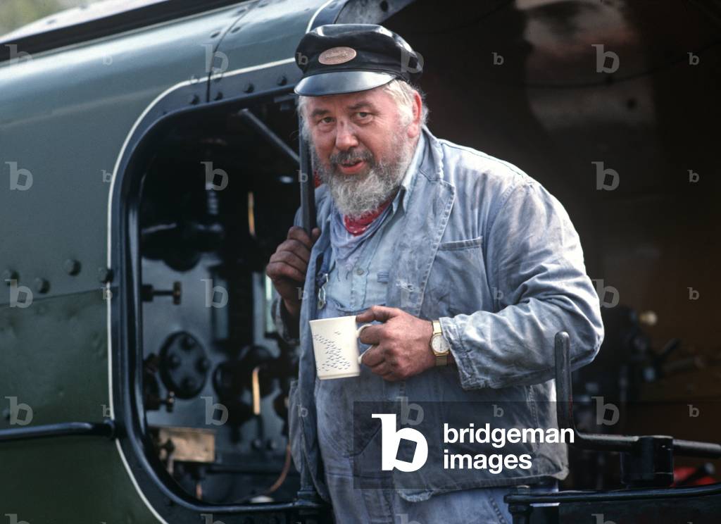 Steam locomotive driver on the Bluebell Heritage Railway, West Sussex, England, UK, 1990 (photo)