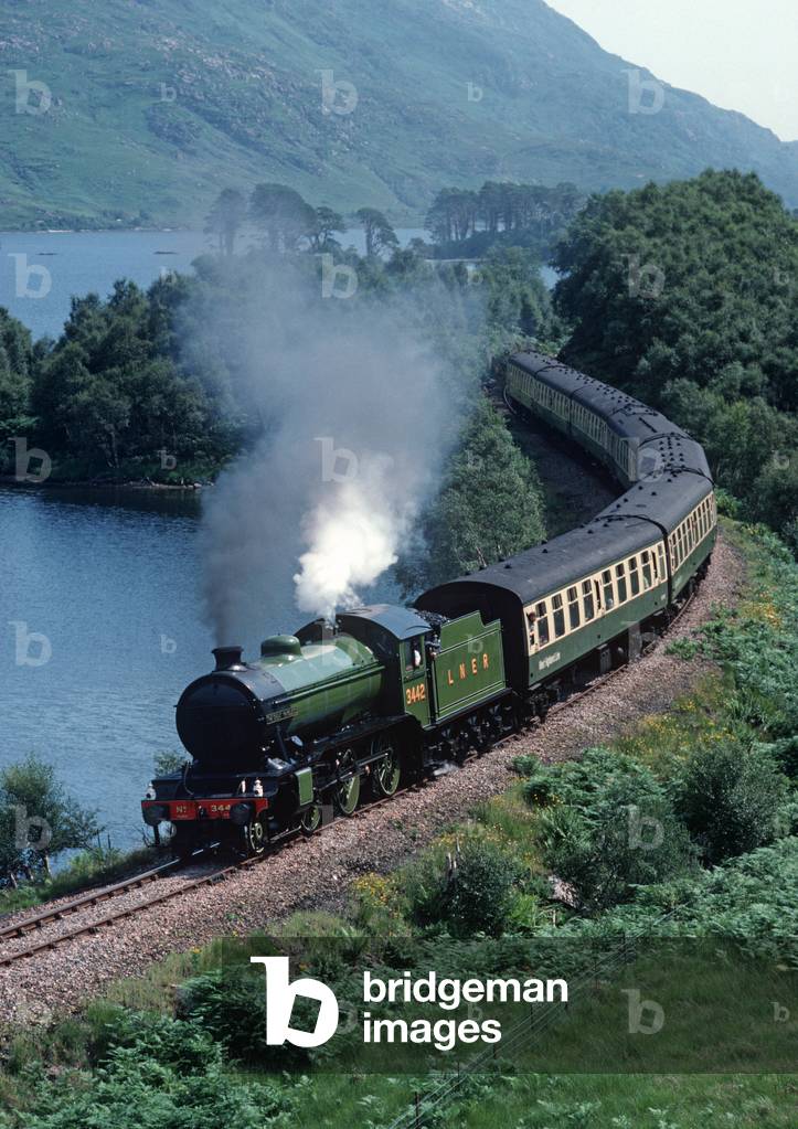 Steam train LNER the Great Marquess alongside Loch Eilt on the West Highland Line, Scotland, 1989 (photograph)