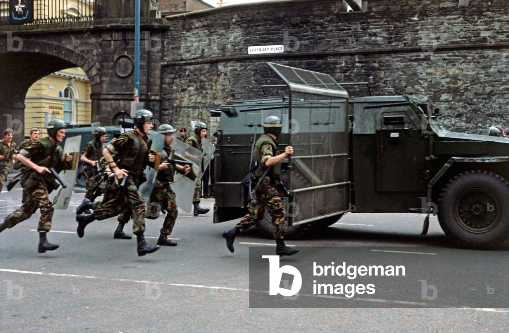 British Army controlling Rioting in the Streets of Derry after Apprentice Boys March during The Troubles, Northern Ireland, 1975