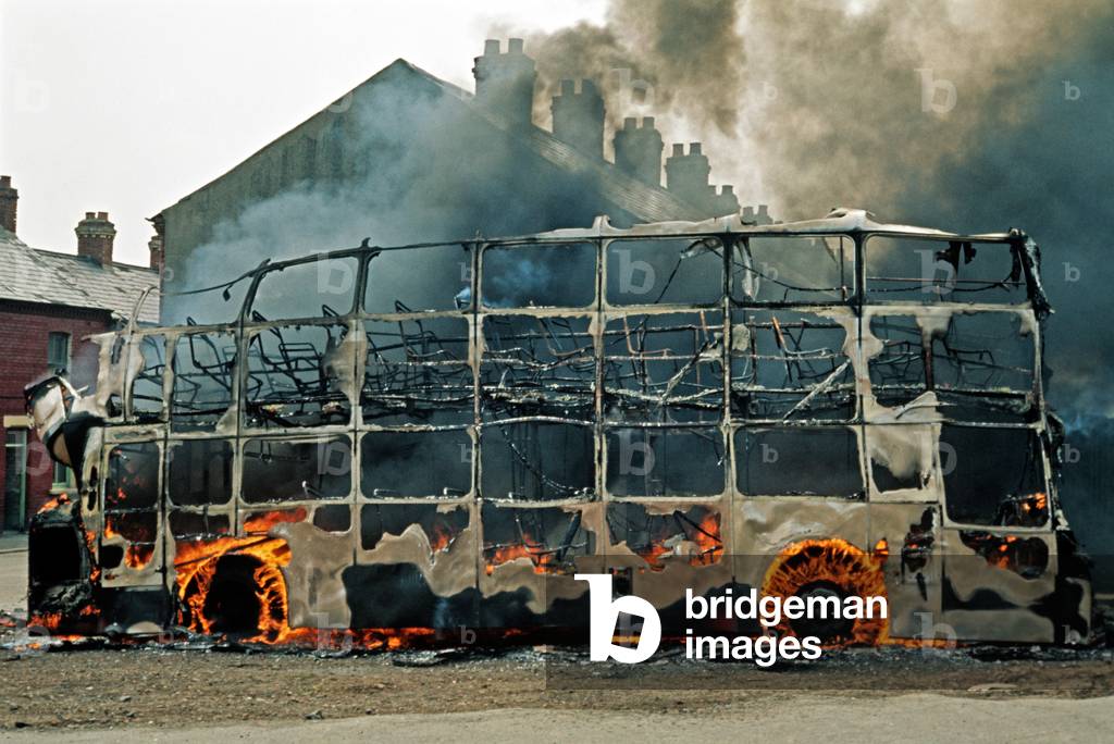 Fire Bombed Hijacked Bus by the IRA during The Troubles, Northern Ireland , 1972 (photo)