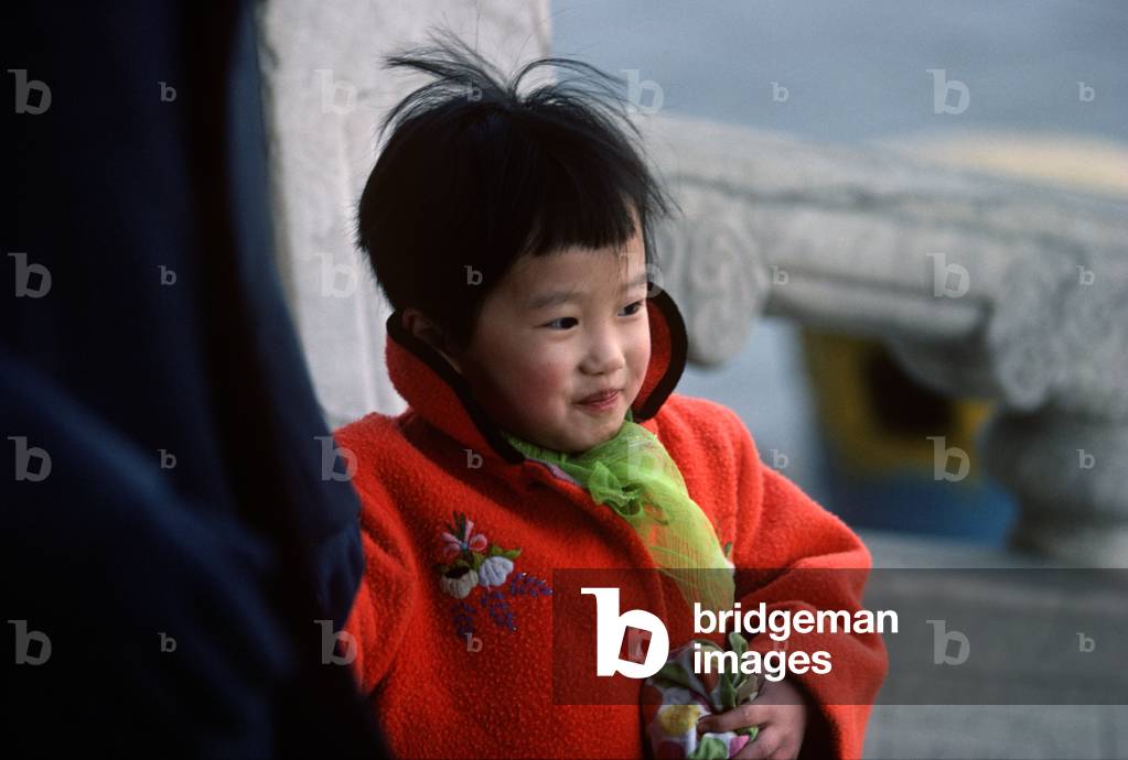 Young Chinese girl in red coat, Shanghai, China, 1979 (photo)