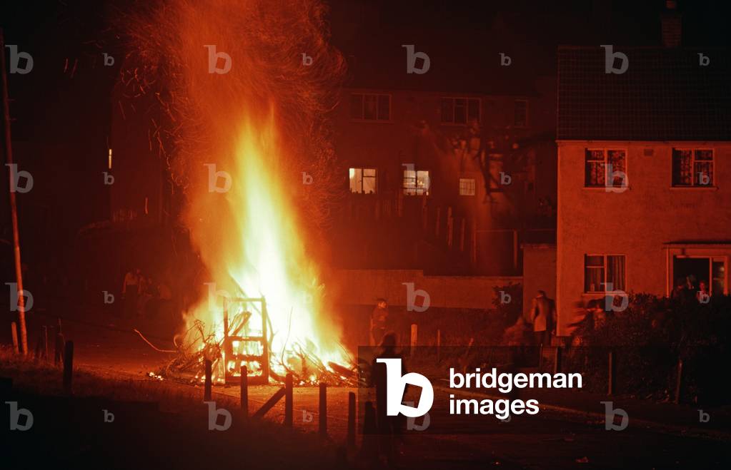 bonfires lit for Internment anniversary in Ballymurphy, a Republican area of West Belfast during The Troubles, Northern Ireland, 1972 (photo)
