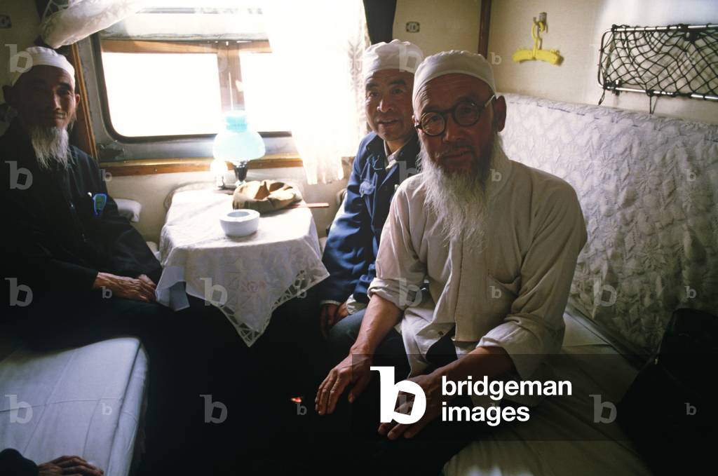 Chinese Muslims on Chinese trains, China (photo)