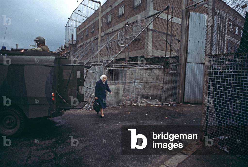 British Army armoured Land Rover leaving fortified RUC, Royal Ulster Constabulary Police Station, Belfast, Nothern Ireland, 1978 (photo)