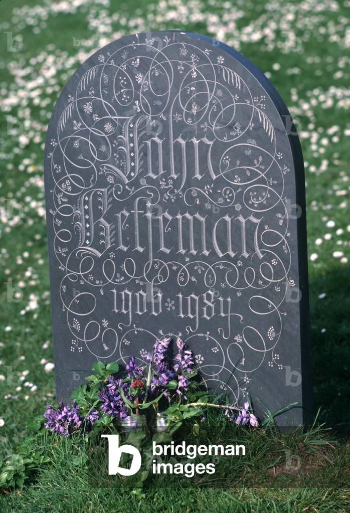 Poet Laureate John Betjeman ornate gravestone in St Enedoc's church, Trebetherick, Cornwall, UK (photo)