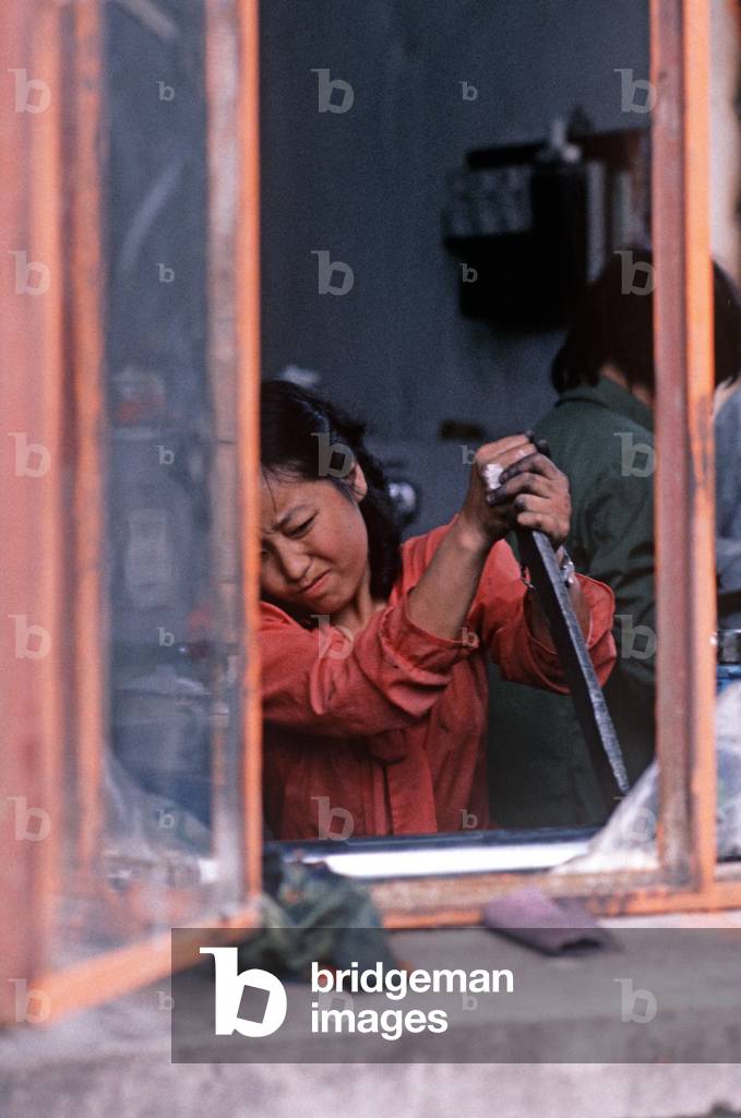 Chinese woman worker in plastics factory, Nanjing, Jiangsu Province, China (photo)
