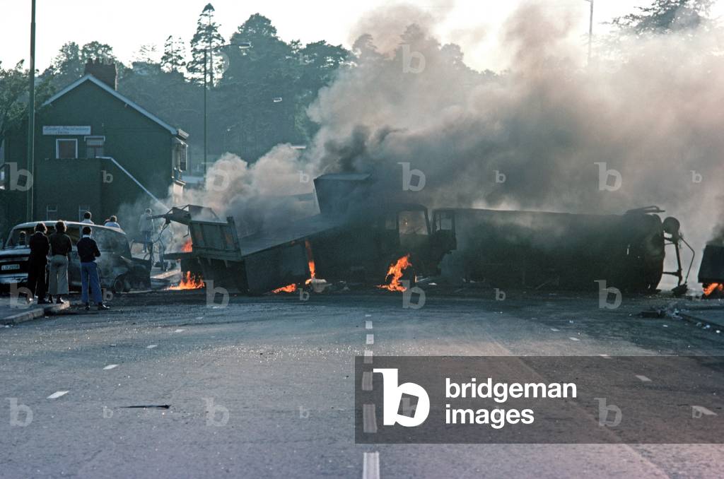 Burning Hijacked Vehicles during Riots on The Falls Road, West Belfast during The Troubles, Northern Ireland, 1976