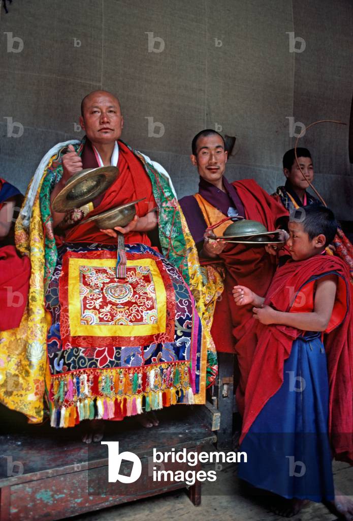 Buddhist monks at the Paro Tshechu, mask dance festival, in the Paro Dzong, Bhutan   (photo)