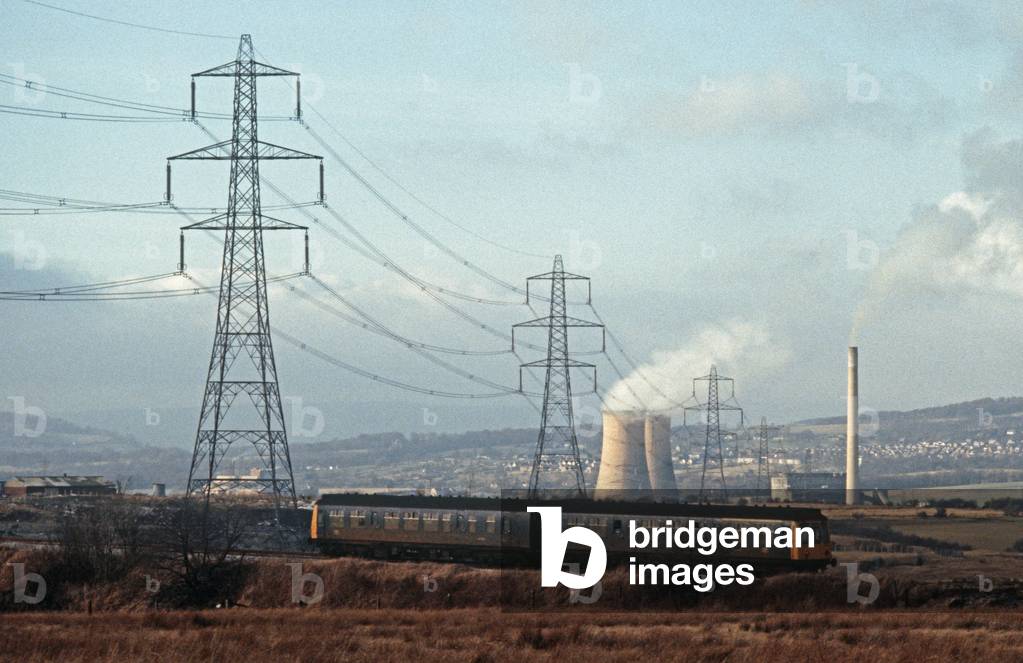 Diesel Multiple Unit in front of cooling towers on the British Rail Preston to Colne railway line, Lancashire, Great Britain , 1982 (photograph)