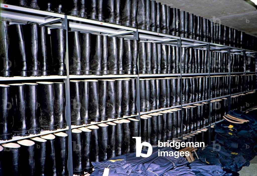 Rubber boots store in a suburban commune underground nuclear fall-out shelter, Switzerland (photo)