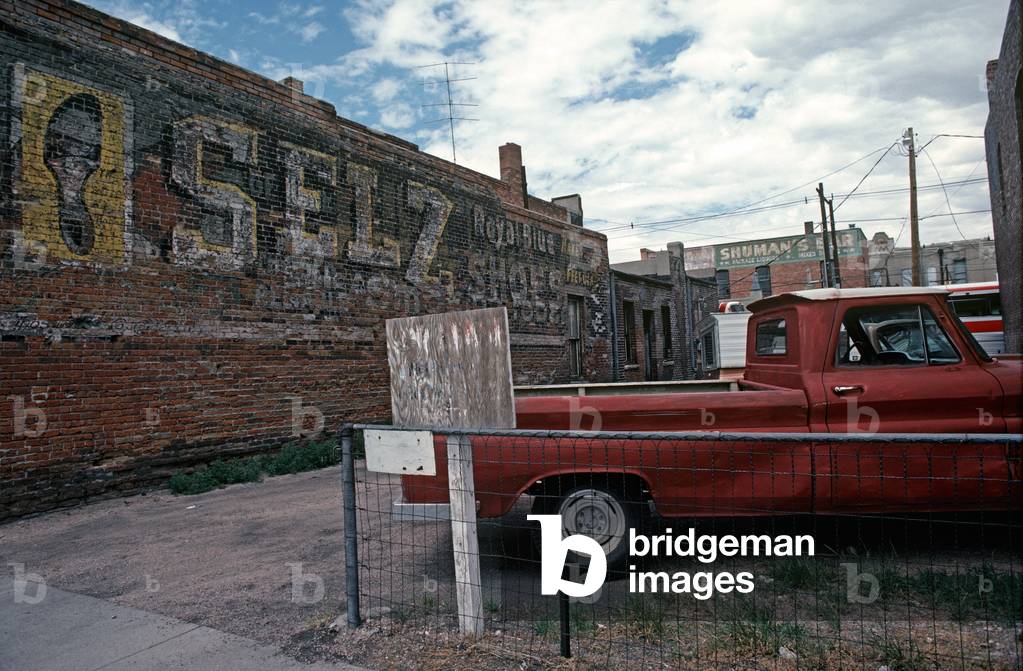 Parking Lot With Old Painted Advertising Sign In Downtown Cheyenne, Wyoming,   (photo)