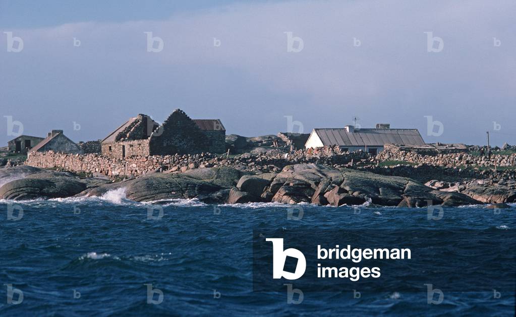 Stone cottage ruins and occupied cottages on Inishturbot Island, Connemara, County Galway, Ireland (photo)