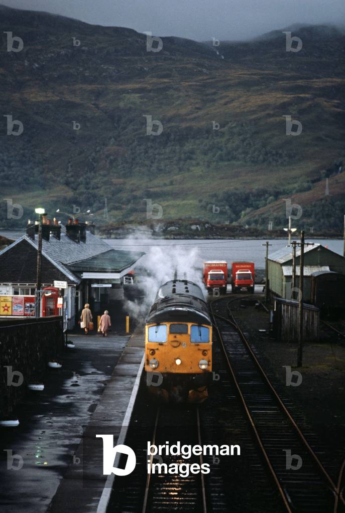 British Rail diesel locomotive in Kyle of Lochalsh railway station with Isle of Skye in background, West coast of Scotland, 1982 (photograph)