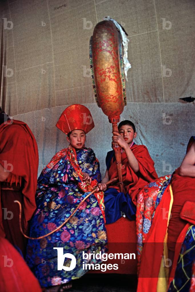 Buddhist child monks at the Paro Tshechu, mask dance festival, in the Paro Dzong, Bhutan (photo)