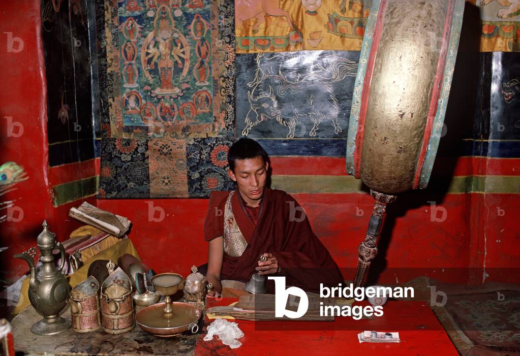 Buddhist monk in Ganden Monastery, destroyed by the Red Guards in 1966, Tibet (photo)