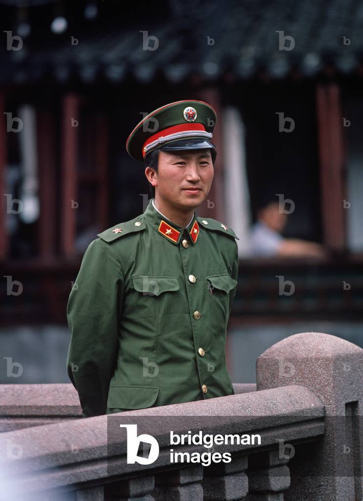 Chinese Army soldier posing for a photograph, China, (photo)