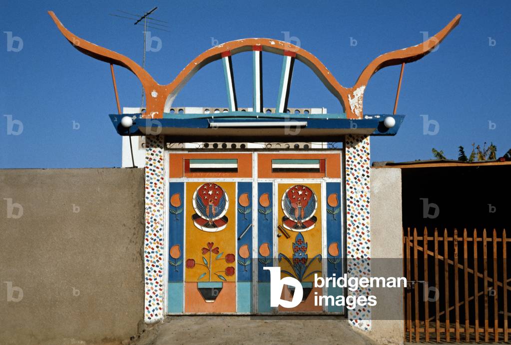 Courtyard entrance painted metal doors, Dubai, United Arab Emirates