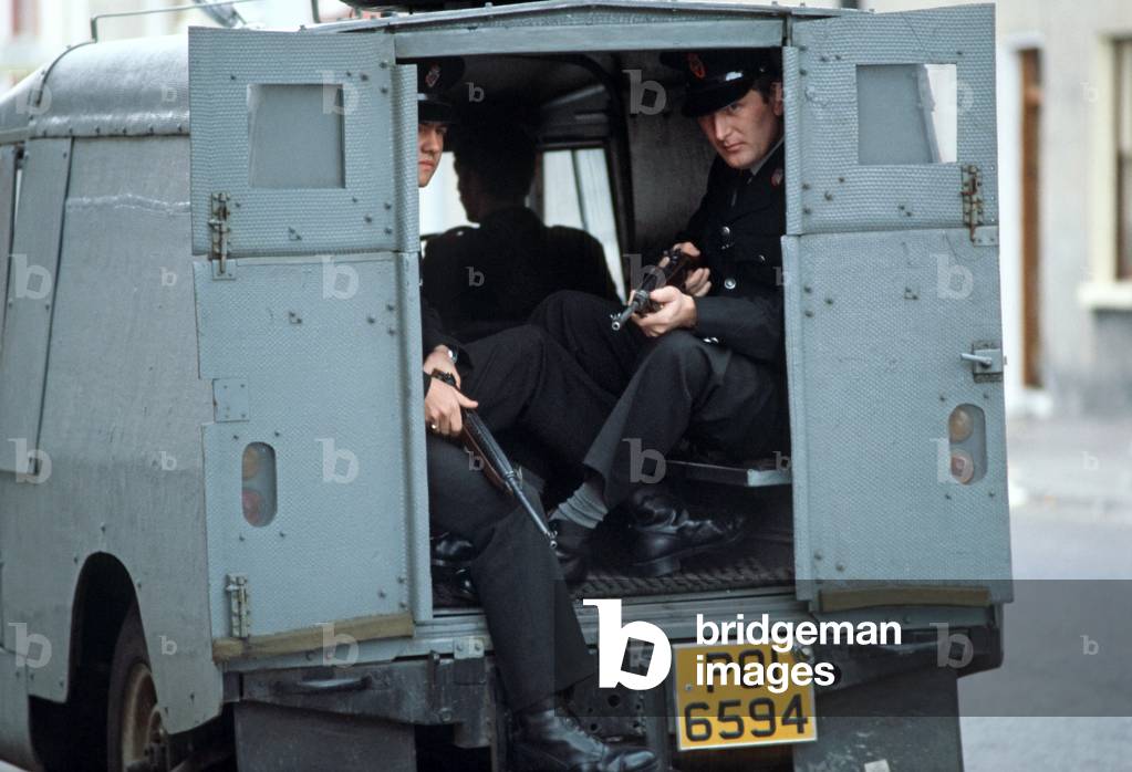 RUC, Royal Ulster Constabulary, Policemen on Patrol in Armoured Land Rover during The Troubles, Northern Ireland, 1978 (photo)