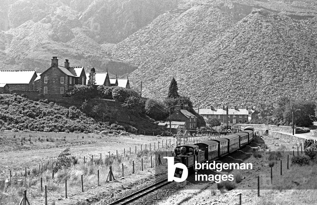 Steam locomotive Merddin Emrys on the Ffestiniog Railway running through Blaenau Ffestiniog slate mines, Gwynedd, North Wales, 1990 (photo)